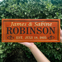 Engraved wooden name sign made from pine, featuring custom names and dates. Single-color finish with heart design. Great gift for weddings or anniversaries.