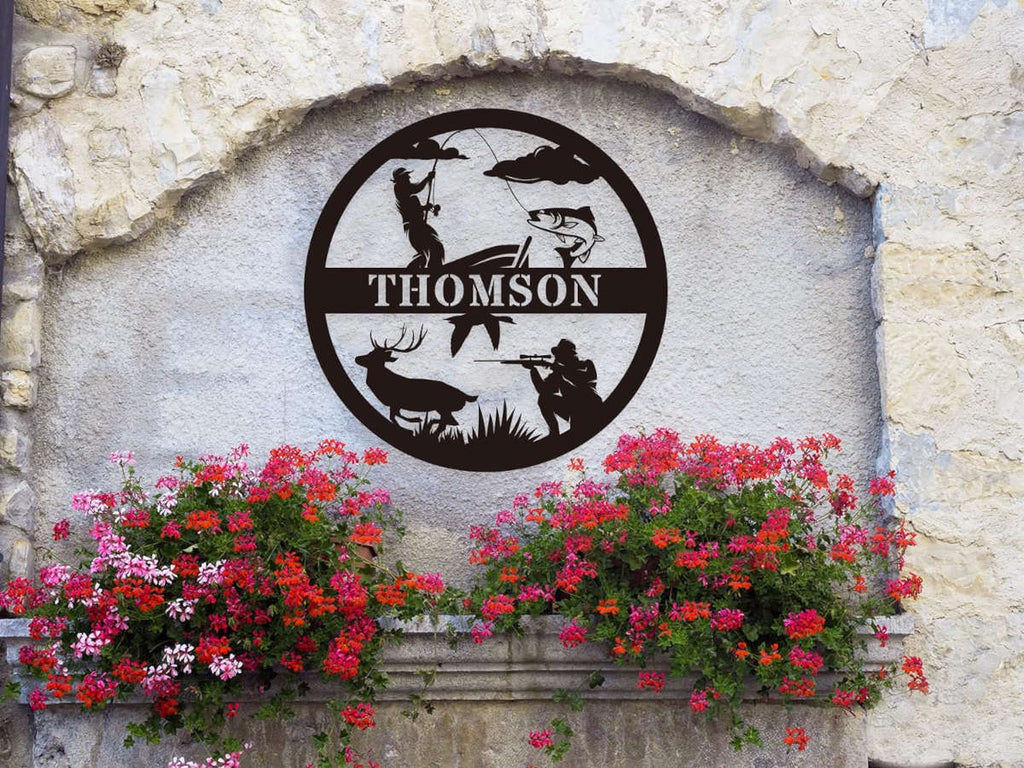 Custom round black metal hunting and fishing sign featuring a fisherman, deer, hunter silhouette, and personalized family name – laser-cut from powder-coated steel for outdoor wall decor.