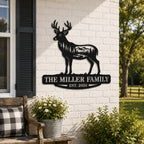 Personalized deer family metal wall sign displayed on a white brick farmhouse exterior with rustic decor.