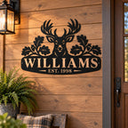 Personalized black deer metal sign mounted on a rustic wood porch wall.