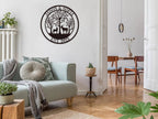 Customizable round black metal sign with a laser-cut design featuring a buck and a doe in a forest of trees. The top text reads "JASON & SOFIA" and the bottom text reads "EST. 2023".