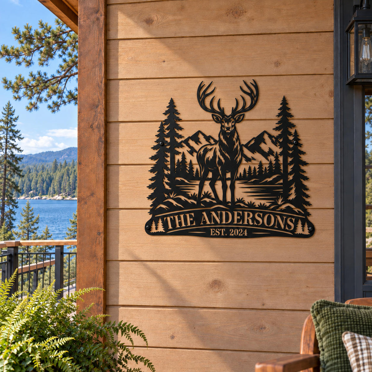 Personalized elk mountain metal sign mounted on the exterior wall of a lakeside cabin.
