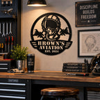 Custom fighter pilot metal sign displayed above a workbench in a warm American garage workshop.
