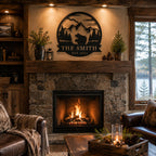 Rustic black iron family name sign above a stone fireplace in a cozy mountain style living room
