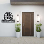 Custom metal address sign with initial, name, and street address