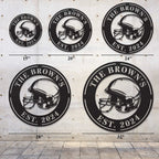 Black metal football helmet sign with personalized text "THE BROWN'S EST. 2024", laser-cut from steel and powder-coated, perfect for sports-themed home decor.