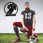 Laser-cut black steel football player metal sign with custom name "JOHNSON", featuring a dynamic running back pose, perfect for personalized sports room or man cave decor.