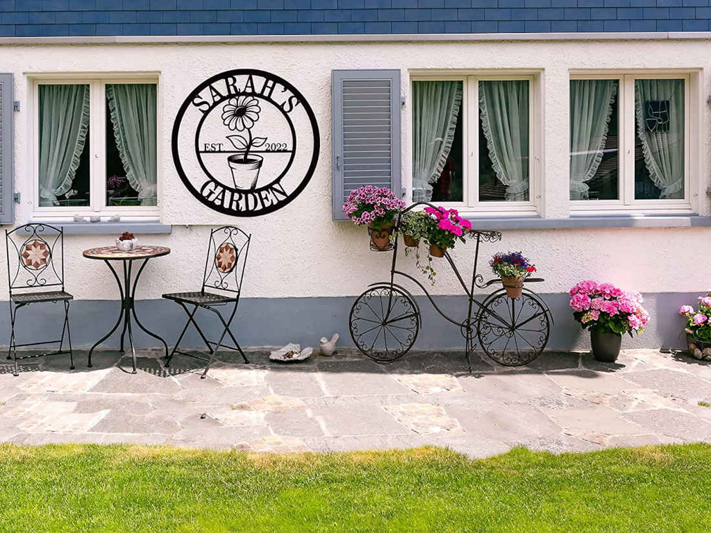 Custom metal garden sign with flower pot design and personalized name, laser-cut and powder-coated for outdoor decor
