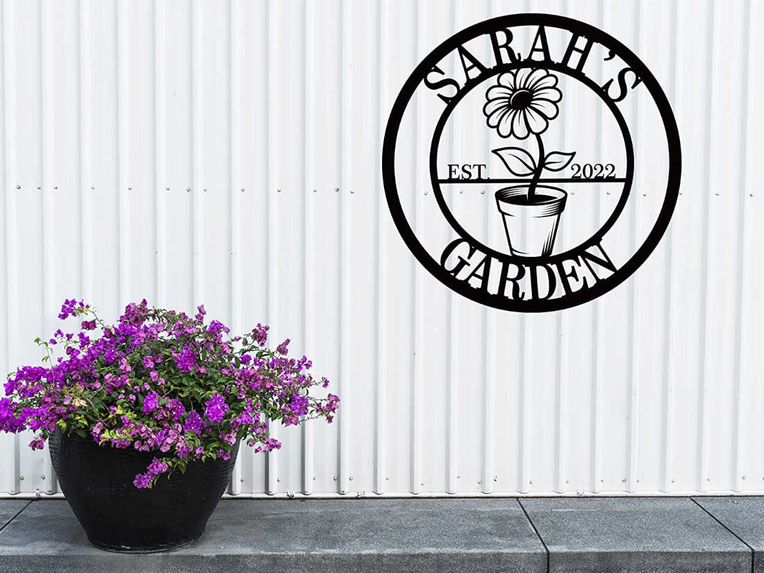 Custom metal garden sign with flower pot design and personalized name, laser-cut and powder-coated for outdoor decor