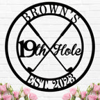 Round custom metal golf sign featuring crossed golf clubs and "19th Hole" text, personalized with name and established year, made from durable powder-coated steel.
