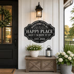 Personalized black steel Happy Place sign displayed on a modern farmhouse exterior wall near the front entrance.