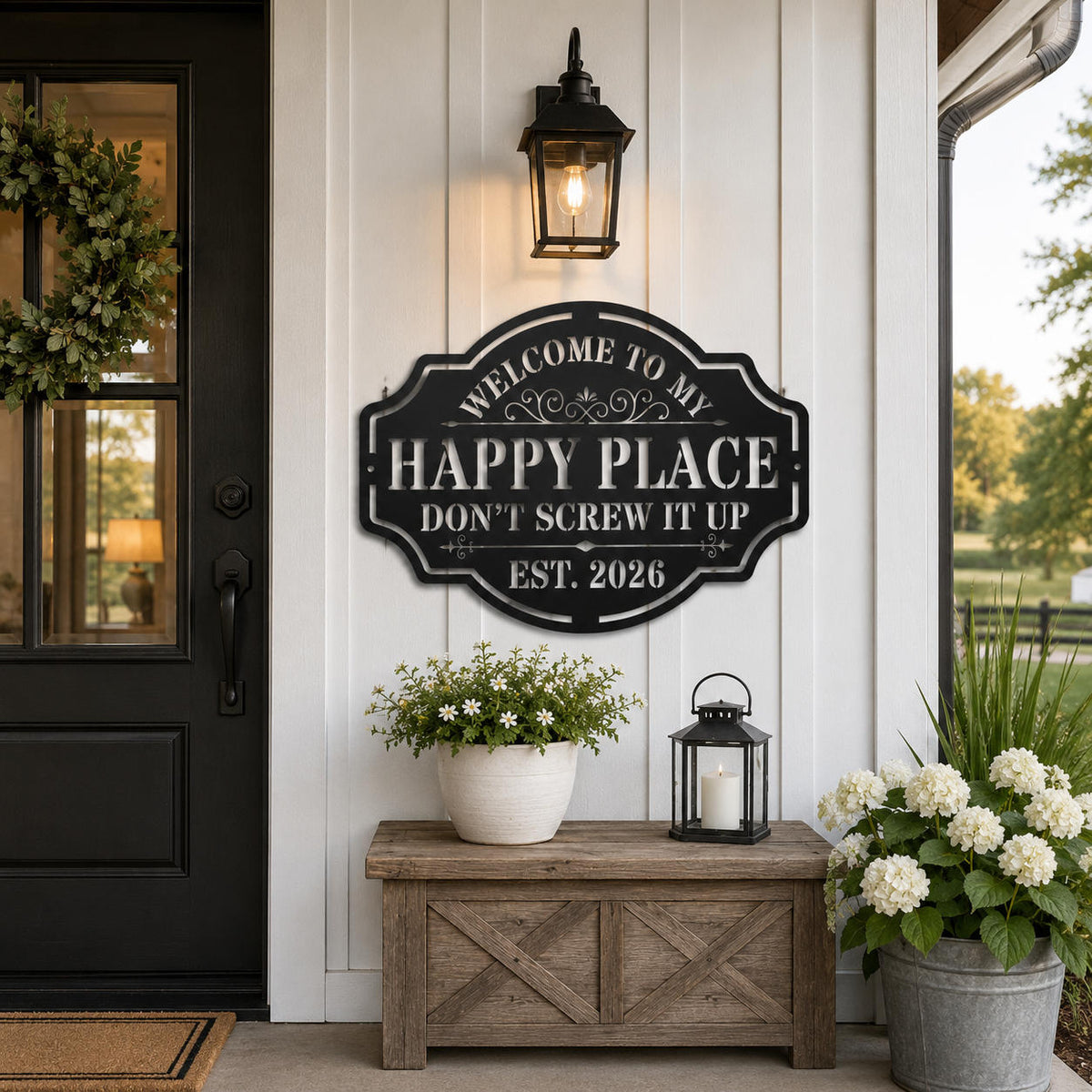 Personalized black steel Happy Place sign displayed on a modern farmhouse exterior wall near the front entrance.