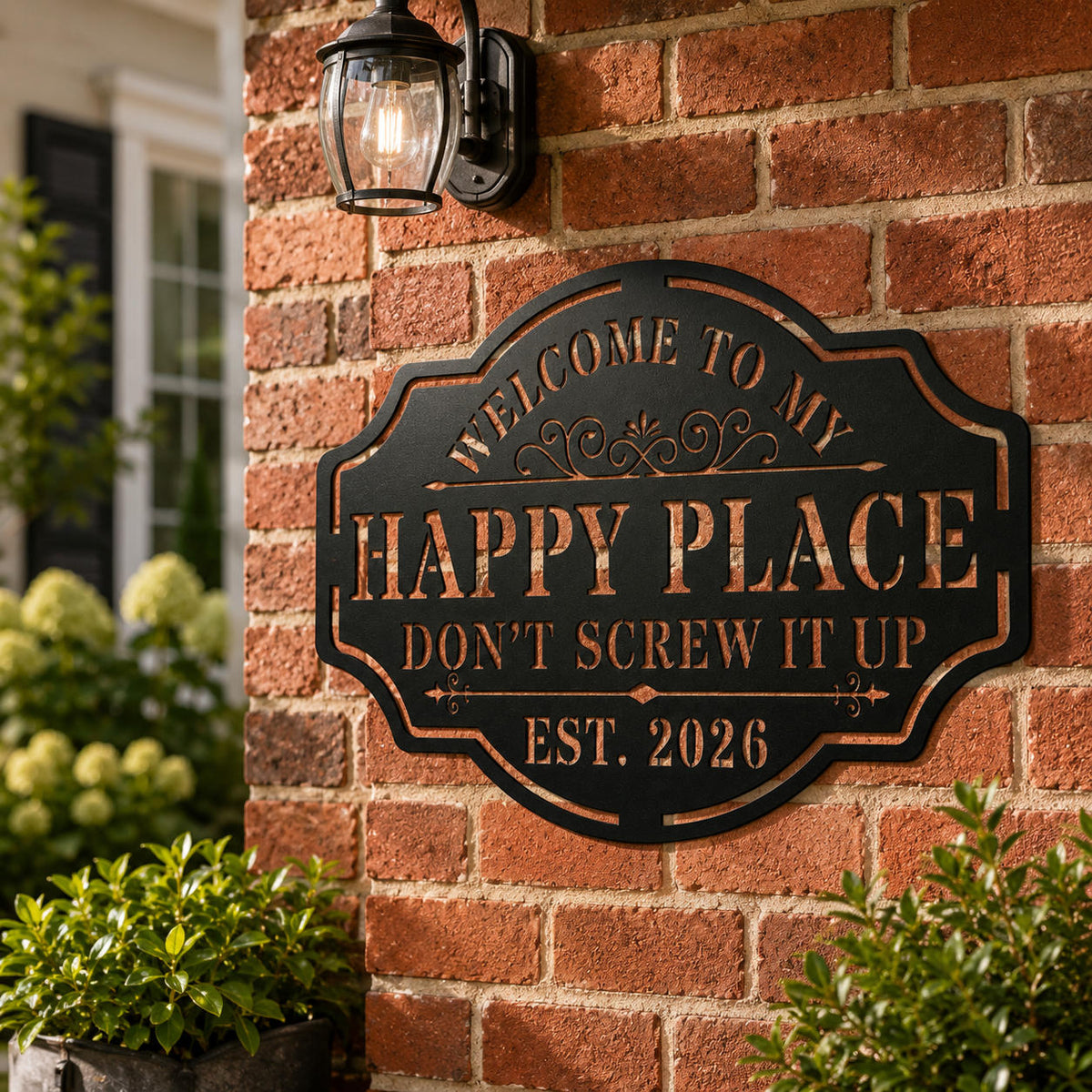 Custom black metal Happy Place sign installed on a red brick exterior wall, personalized outdoor welcome decor.