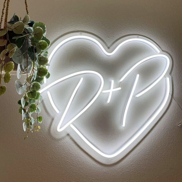 Custom heart initial neon sign with LED glow, featuring personalized letters inside a heart outline for home décor or romantic gifts