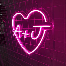 Custom heart initial neon sign with LED glow, featuring personalized letters inside a heart outline for home décor or romantic gifts