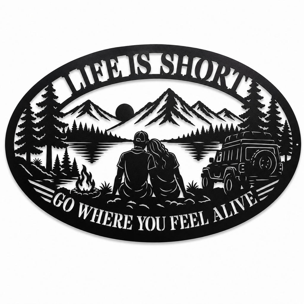 Black oval metal camping wall sign with mountain, lake, couple, campfire, and off-road vehicle design on a white background.