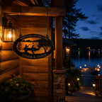 Elegant personalized metal lake cabin sign illuminated by warm outdoor lighting at night
