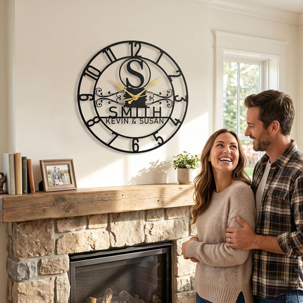 Personalized black steel wall clock with Arabic numerals, gold hands, and custom family names.