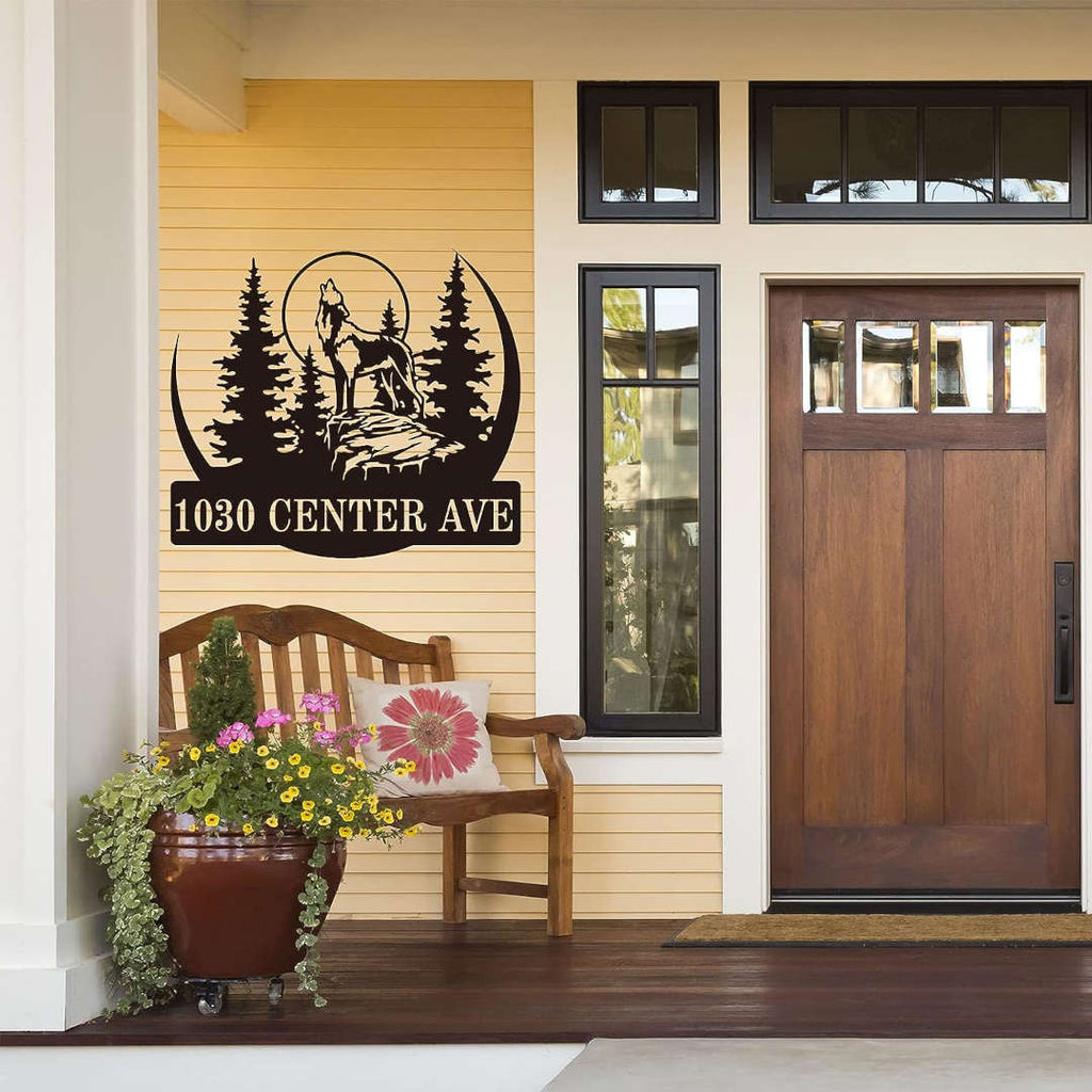Custom laser-cut metal sign with howling wolf, pine forest, and personalized address  in durable powder-coated steel for outdoor use.