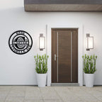 Custom round metal address sign with name and address laser-cut into black powder-coated steel
