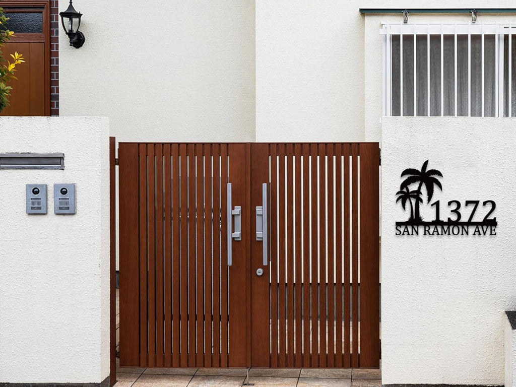 Custom metal palm tree address sign with house number and street name in black powder-coated steel, wall-mounted design