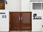 Custom metal palm tree address sign with house number and street name in black powder-coated steel, wall-mounted design
