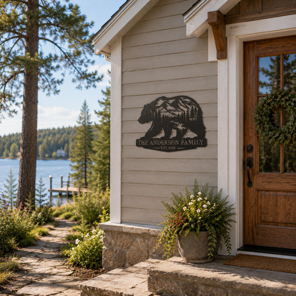 Personalized bear mountain metal sign displayed at a woodland lake house entrance.