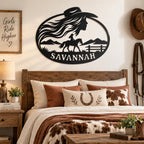 Personalized Savannah cowgirl metal name sign displayed above a rustic Western bedroom.