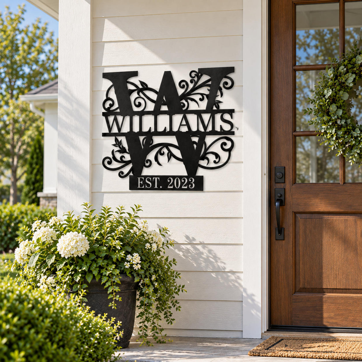 Personalized Williams family monogram metal sign displayed on a modern farmhouse exterior wall.
