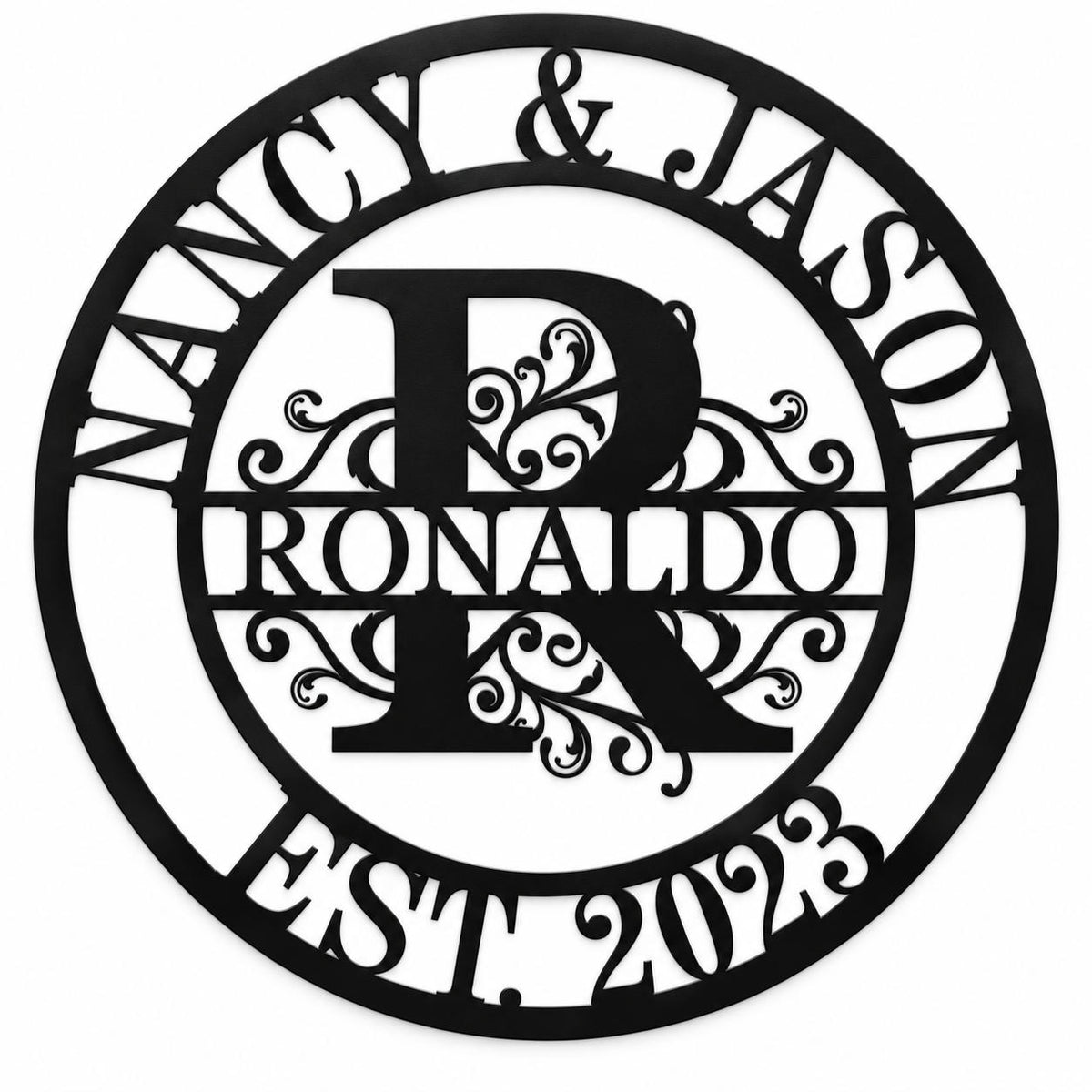 Personalized round black metal sign with an ornate R, Nancy & Jason, Ronaldo, and EST. 2023 on a white background.