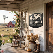 Custom metal farm sign with barn, animals, windmill silhouette. Personalizable name and tagline 'WHERE DREAMS TAKE ROOT'. Pre-drilled holes.