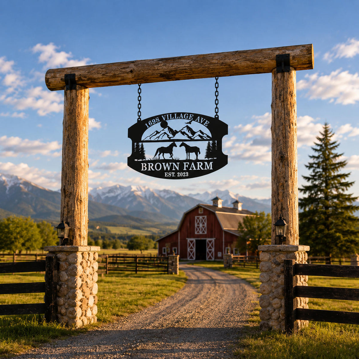 Personalized metal farm sign hanging at a rustic wooden ranch entrance with red barn and mountain scenery.