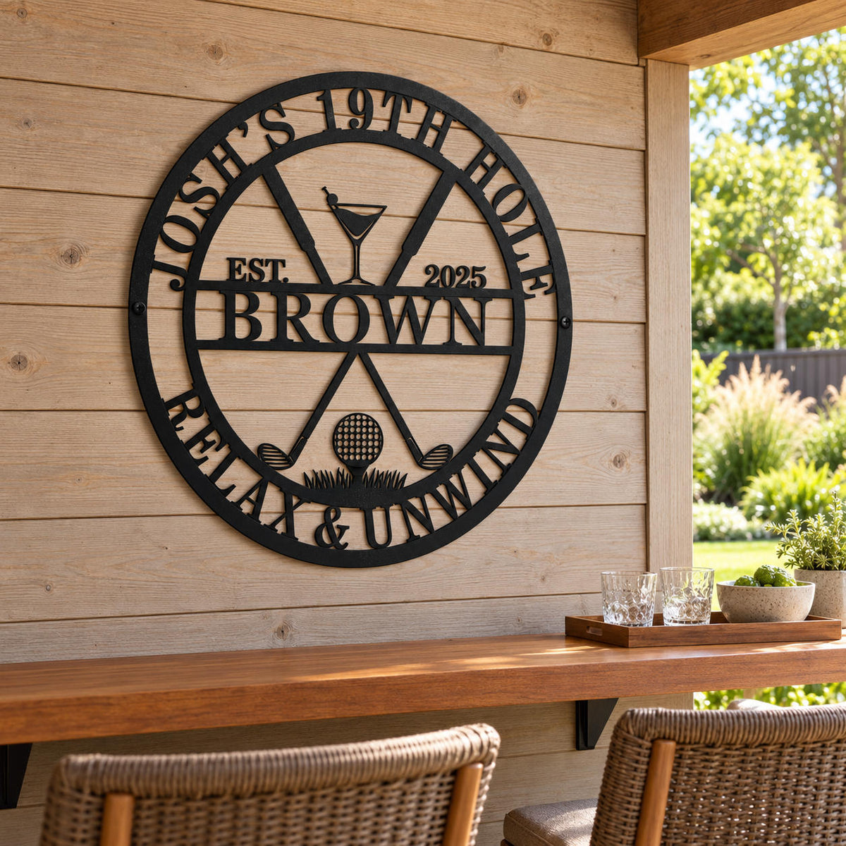 Personalized black metal golf bar sign on a wood wall above a covered patio bar, with woven stools and a sunlit garden nearby.