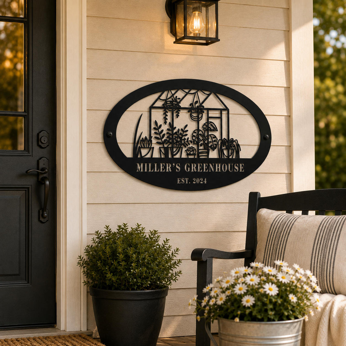 Personalized black greenhouse metal sign mounted beside a front door on a welcoming porch with plants and outdoor decor.