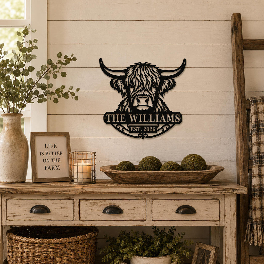 Personalized Highland cow metal family sign mounted on a wall in a cozy farmhouse interior.