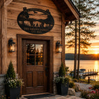 Personalized lake house metal sign mounted above a rustic cabin entrance overlooking the lake at sunset.
