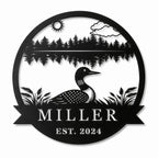 Personalized Miller loon lake house metal sign with pine trees and Est. 2024 on a white background.