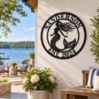 Personalized mermaid metal sign displayed on a lake house patio overlooking the water.