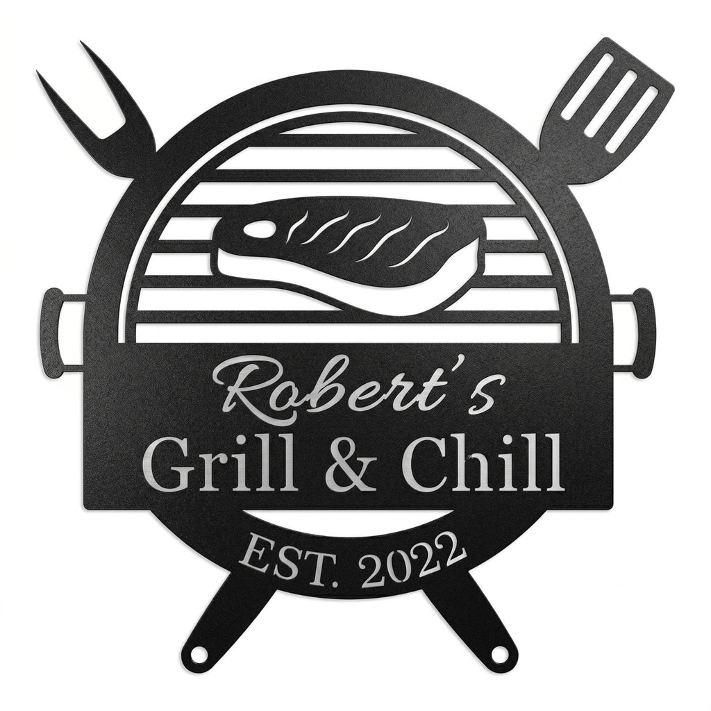 Customized metal BBQ grill name sign featuring a laser-cut steak and grill design, personalized with "Robert's Grill & Chill" and "Est. 2022" on a white brick wall.