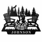 Personalized metal campfire family name sign with Adirondack chairs and pine trees on a clean white background.