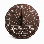 Personalized bronze metal sundial with custom names, anniversary date, and inspirational quote on a white background.
