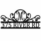 Personalized black metal monogram address sign with decorative scrollwork and custom address.