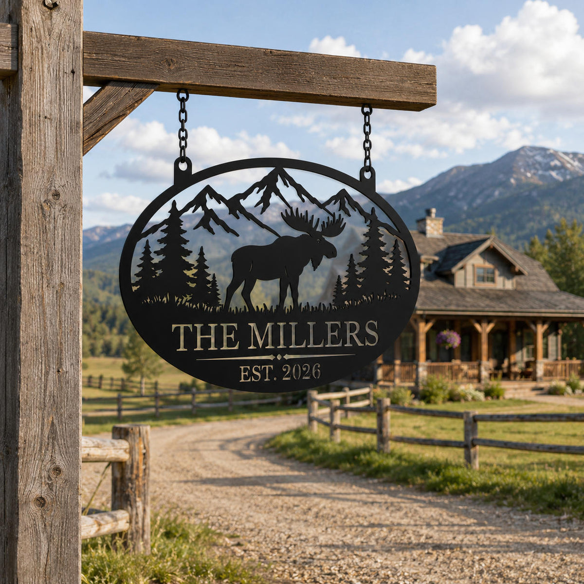 Personalized moose metal family sign hanging at a rustic ranch entrance with mountains in the background.
