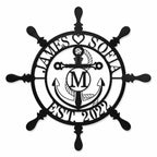 Personalized nautical metal ship wheel wall decor with anchor, custom family name, monogram initial and established year, black powder-coated steel sign.