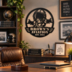 Personalized aviation metal sign displayed in a masculine home office with warm wood furnishings.