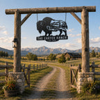 Personalized buffalo metal sign displayed at a rustic wooden ranch entrance.