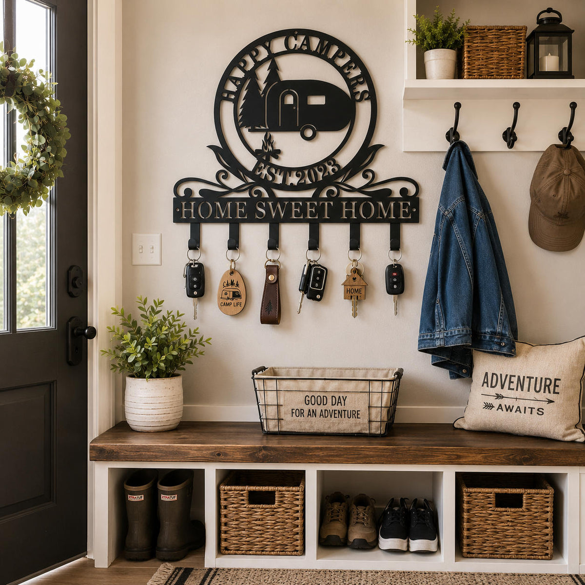 Personalized camper metal key holder mounted in a mudroom entryway for organizing family keys and everyday essentials.