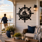 Custom ship wheel metal sign decorating a seaside patio with ocean views and nautical outdoor décor.