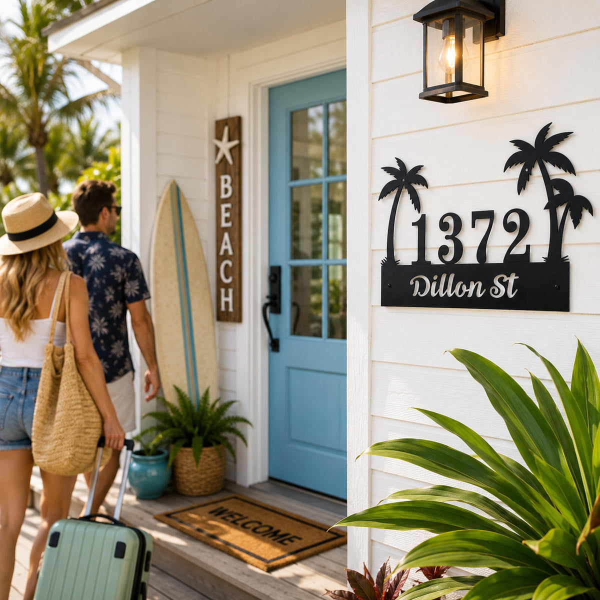 Personalized tropical palm tree metal address sign installed at the entrance of a beach-style Airbnb vacation rental.