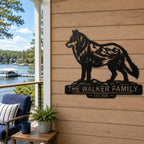 Personalized wolf metal sign displayed on a lakeside vacation home porch.